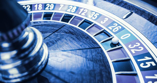 a roulette wheel with a ball in the zero pocket