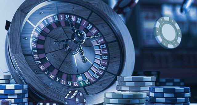 a roulette wheel, dice, and stacks of casino tokens