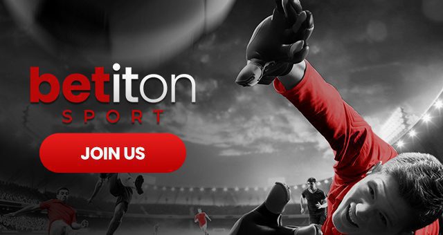 a goalkeeper with a red jersey fails to catch a ball and to his side there is the Betiton Sport logo and button saying "join us"