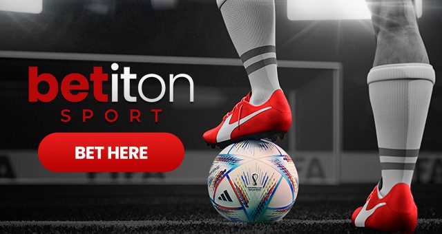 a footballer with red shoes holding a ball under his foot with the Betiton Sport logo and a button that says "bet here" for world cup betting