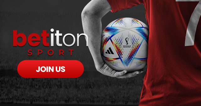 a footballer with a red jersey with the number 7 on it holding the official 2022 World Cup football and the Betiton Sport logo with a button saying join us