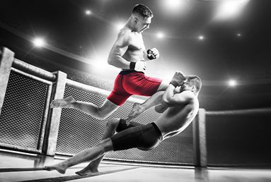 ufc fighter with red shorts knocks out another fighter with a knee to the face