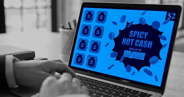 someone playing an online scratch card called spicy hot cash on their laptop