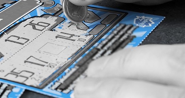 player playing a blue scratch card, almost finishing it