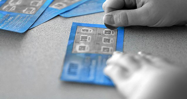 a person about to play a blue scratch card