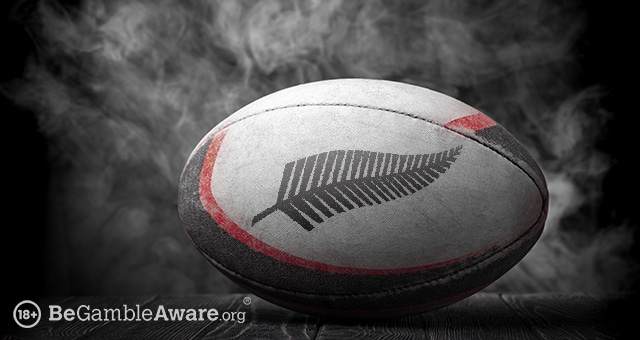 rugby ball with the logo of the all blacks