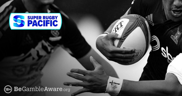 a rugby player evading another in the super rugby