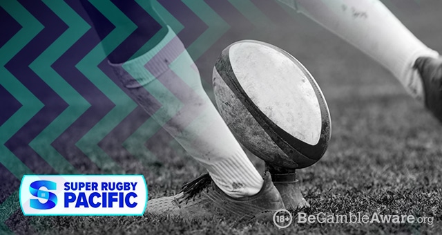 a player kicking a rugby ball in the super rugby