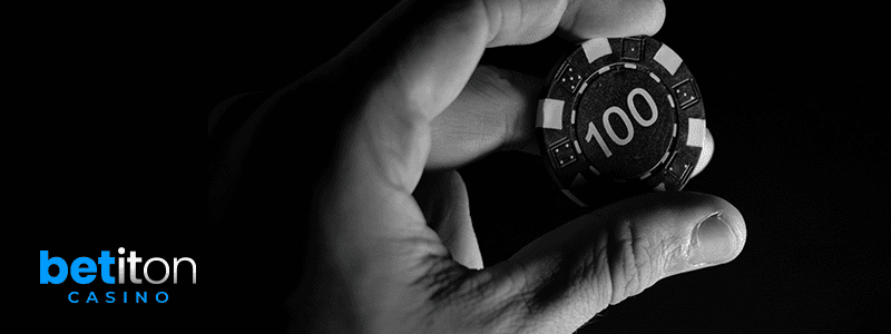 man holding blackjack chip