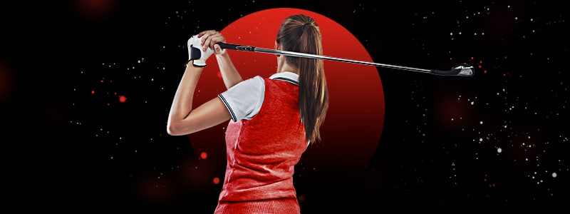 female golf player preparing to hit