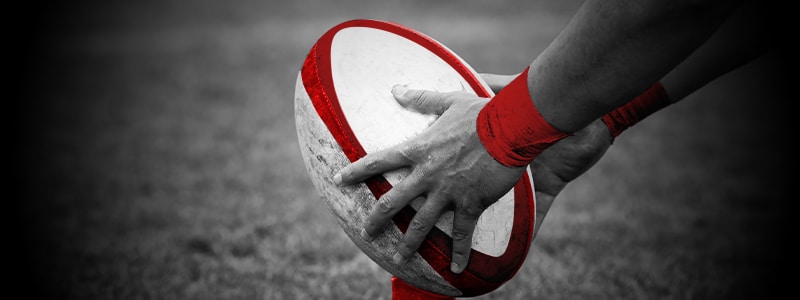 rugby ball in a player's hands